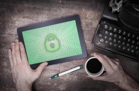 Tablet on a desk, concept of data protection Photos