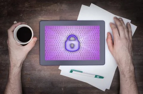 Tablet on a desk, concept of data protection Photos