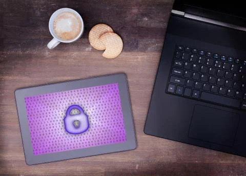 Tablet on a desk, concept of data protection Photos