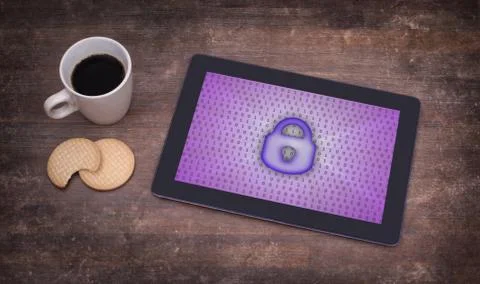 Tablet on a desk, concept of data protection Photos