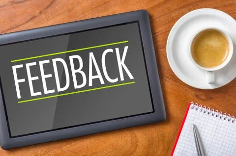 Tablet on a desk - feedback Stock Photos