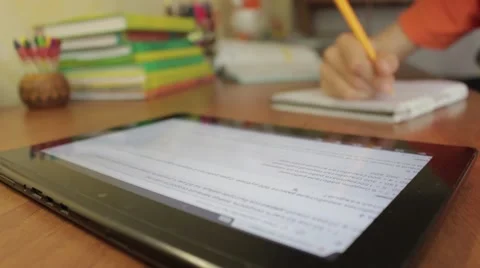 Tablet device being used by a student during his math class. Vidéo 49928294