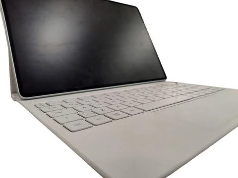 Tablet device with detachable keyboard on white Stock Photos