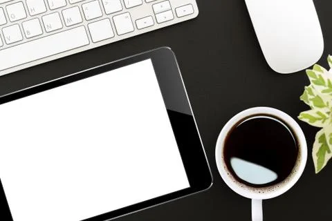 Tablet digital on work desk top view Stock Photos