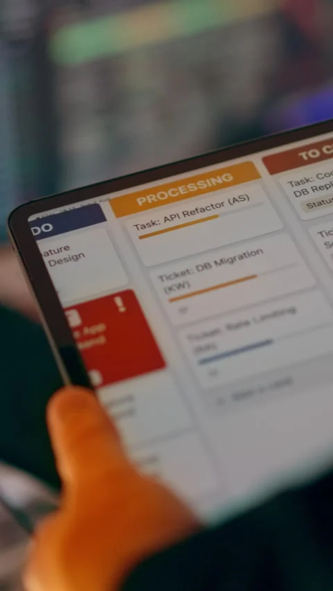 Tablet Displaying Agile Task Management Board with Urgent Ticket Stock Footage 341570364