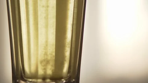 A tablet dissolving in a glass of water close-up. A quick cure for colds during Stock Footage 114020809