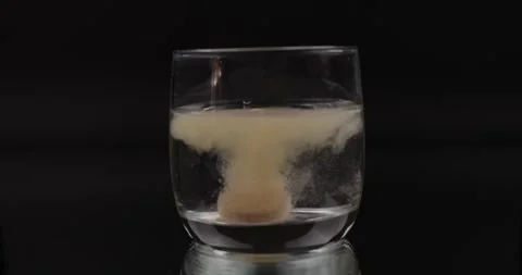 Tablet Dissolving in Slow Motion Stock Footage 279802222