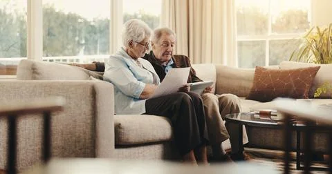 Tablet, documents and planning with old couple on sofa for account review, check Stock-Fotos