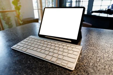 Tablet with empty white screen in cafe tablet blank screen browsing internet  스톡 사진