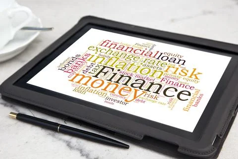 Tablet with finance word cloud Stock Photos