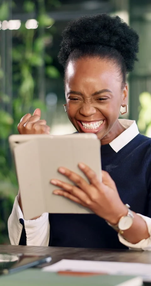 Tablet, fist pump and black woman in office with good news, positive feedback or Stock Footage 340600671