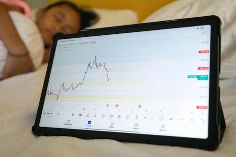 Tablet with forex chart trading on bed. Illustration about trading anywhere Stock Photos