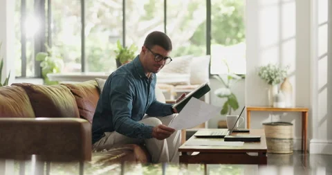 Tablet, freelancer and documents with man on sofa for blog writer, virtual Stock Footage 329365722