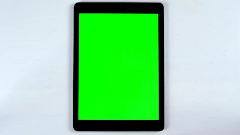 Tablet with a green background. Stock Photos
