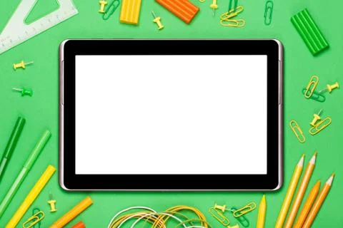 Tablet on a green background Stock Photos