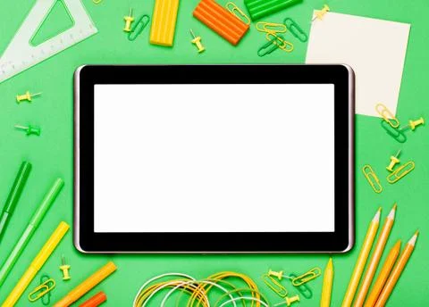 Tablet on a green background Stock Photos