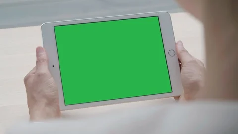 Tablet Green Screen Chroma View, Over Shoulder Social Holding Screen Device Video stock 94431261