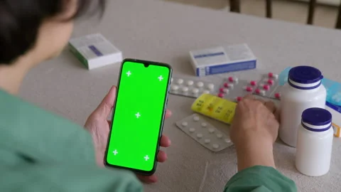 Tablet with green screen chromakey display in elderly woman hand Stock Footage 265004725