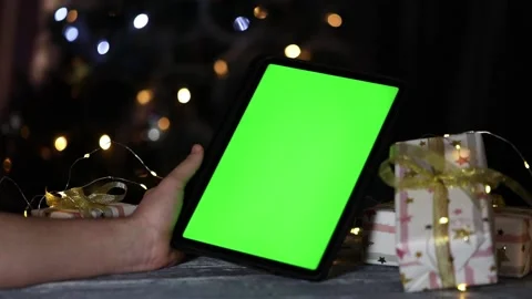 Tablet with green screen in hands next to glass of coffee Stock-Footage 236907491