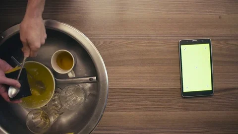 A tablet with green screen on the kitchen table Stock Footage