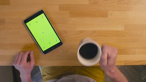 A tablet with green screen on the kitchen table Stock Footage