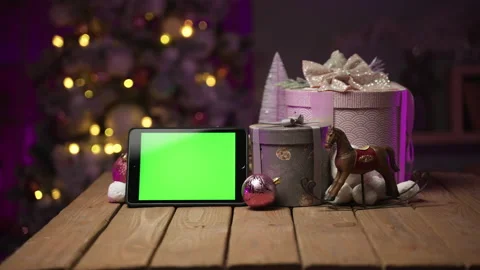 Tablet with green screen for mock-up in the New Year concept with Christmas tree Stock Footage 165943649