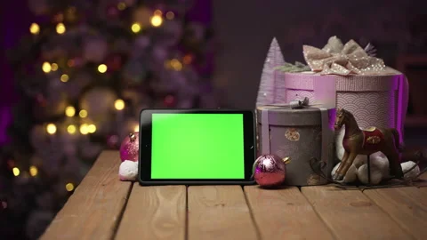 Tablet with green screen for mock-up in the New Year concept with Christmas tree Stock Footage 166031776