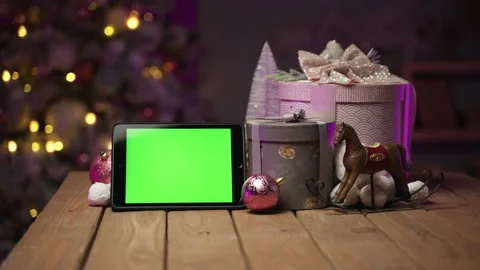 Tablet with green screen for mock-up in the New Year concept with Christmas tree Stock Footage 166395693