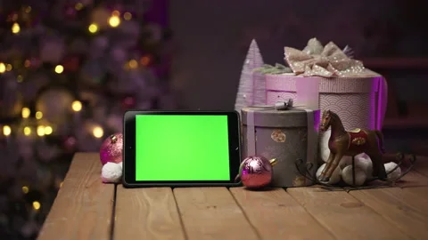 Tablet with green screen for mock-up in the New Year concept with Christmas tree Stock Footage 166396410