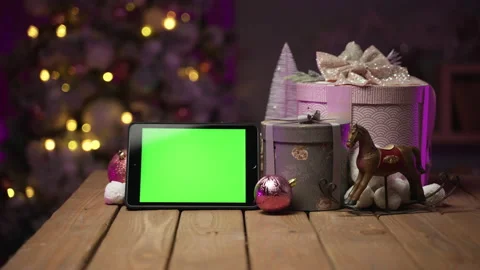 Tablet with green screen for mock-up in the New Year concept with Christmas tree Stock Footage 166397411