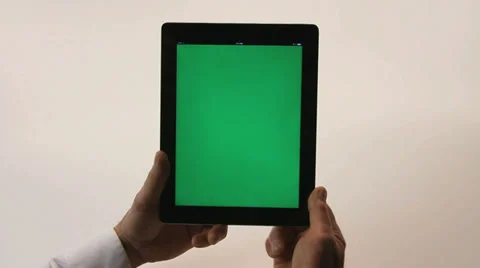 TABLET WITH GREENSCREEN AGAINST WHITE Stock Footage 35349818