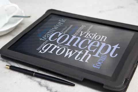 Tablet with growth concept word cloud Stock Photos