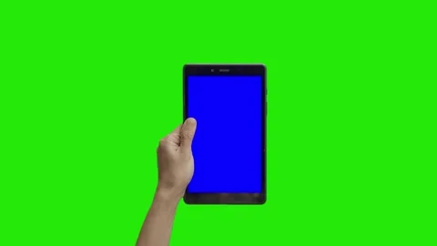 Tablet in the hand close up isolated at green background. Tablet screen is blue  Stock Footage 198296898