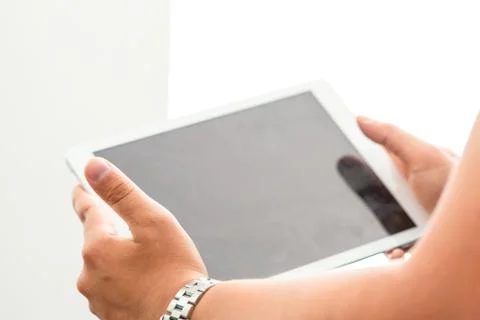 Tablet on hand Stock Photos