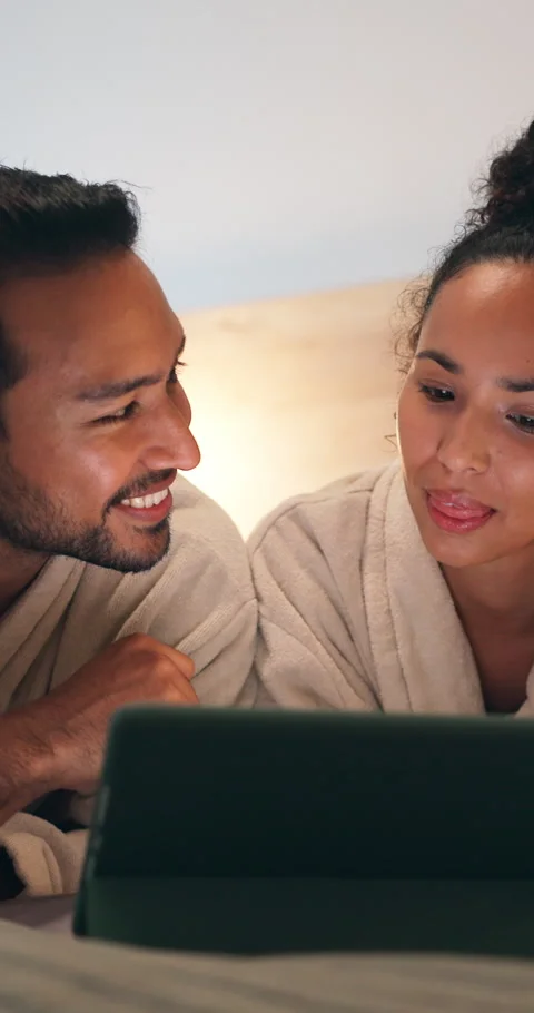Tablet, happy and couple on bed in home with browsing social media, internet or Stock Footage 340878149