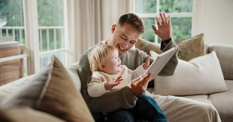 Tablet, high five and dad with baby on sofa in home with educational game for Stock Footage 341427511