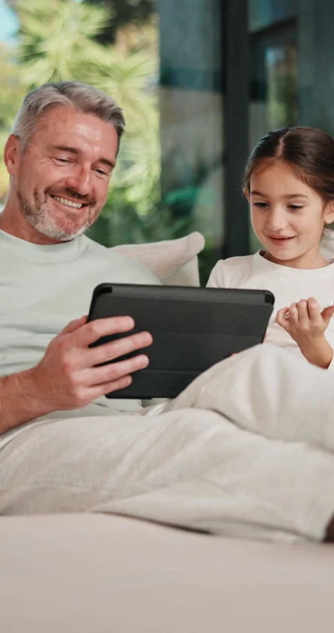 Tablet, high five and father with kid on sofa in home for educational game on Stock Footage 335875904