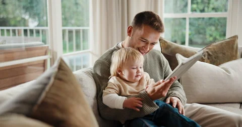 Tablet, high five and father with baby on sofa in home with educational game for Stock Footage 341431808