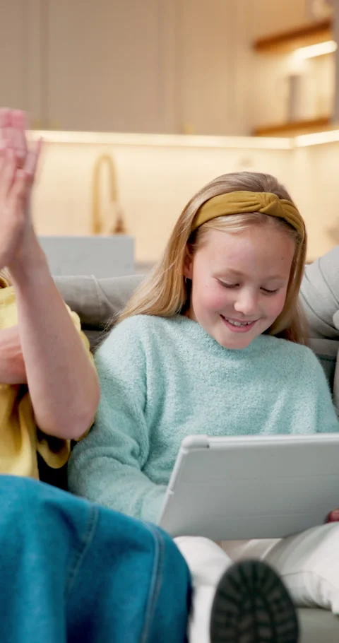 Tablet, high five and kid with parents on sofa in home for playing educational Stock Footage 340967573