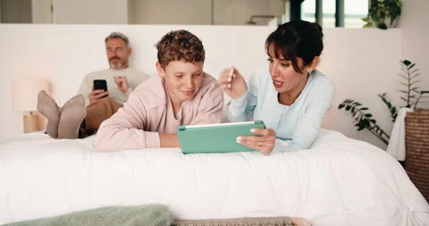 Tablet, high five and mother bonding with kid on bed for quiz game, correct Stock Footage 335510913