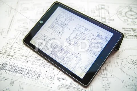 The tablet (ipod) by blueprints engineering project background Stock Photos