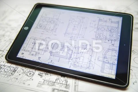 The tablet (ipod) by blueprints engineering project background Stock Photos