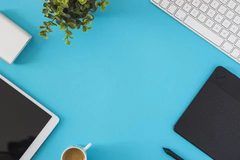 Tablet with keyboard on blue table. High quality and resolution beautiful photo Stock Photos