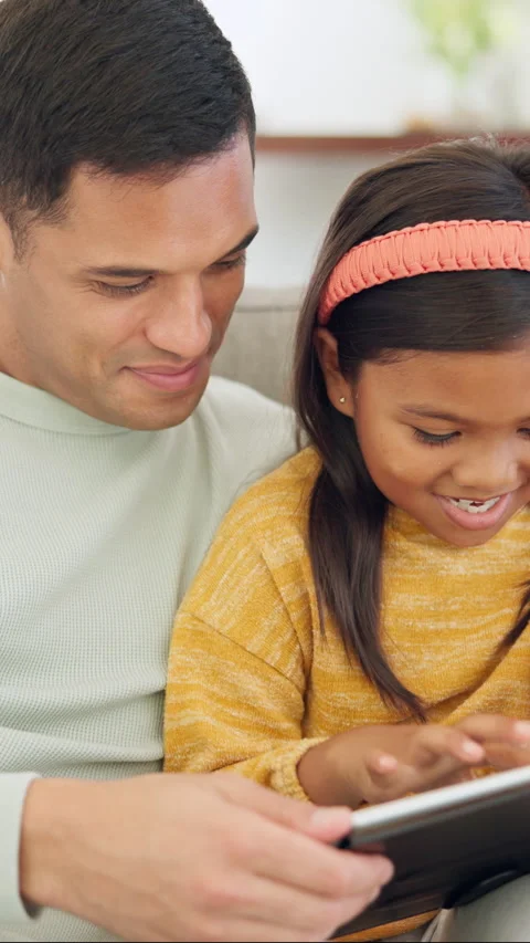 Tablet, kid and father on sofa in home for bonding, teaching and online learning Stock Footage 335371031