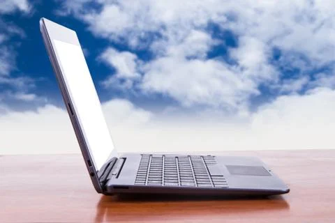 Tablet laptop with cloudy background Stock Photos