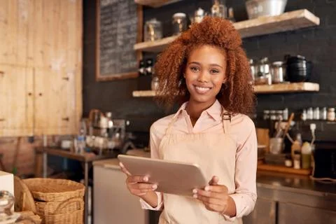 This tablet makes running my cafe so easy Stock Photos