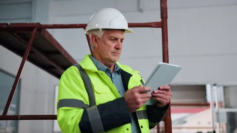 Tablet, man and construction worker on site with planning for maintenance Stock Footage 341567989