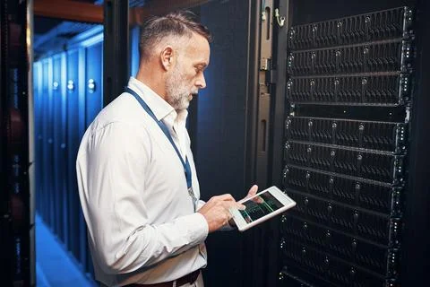 Tablet, man and engineer in data center with inspection, research or programming Stock Photos