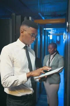 Tablet, man and inspection in server room for maintenance, system performan.. Stock Photos