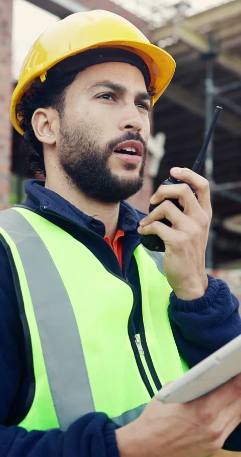 Tablet, man and radio on construction site with communication for building, Stock Footage 336776469
